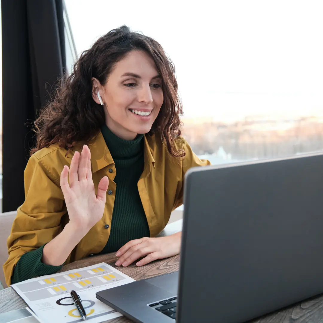 A smiling student learning math with the help of a private tutor online